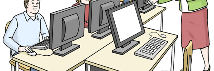 Mehrere Menschen am Computer mit Lehrerin
