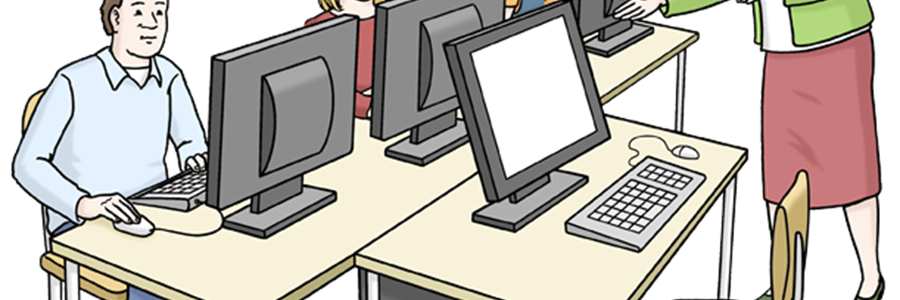 Mehrere Menschen am Computer mit Lehrerin